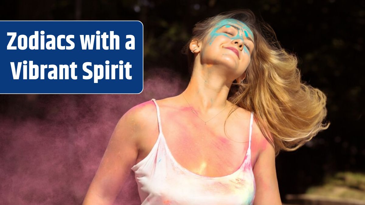 Cool blonde woman with long curly hair fluttering on wind with Holi dry paint.